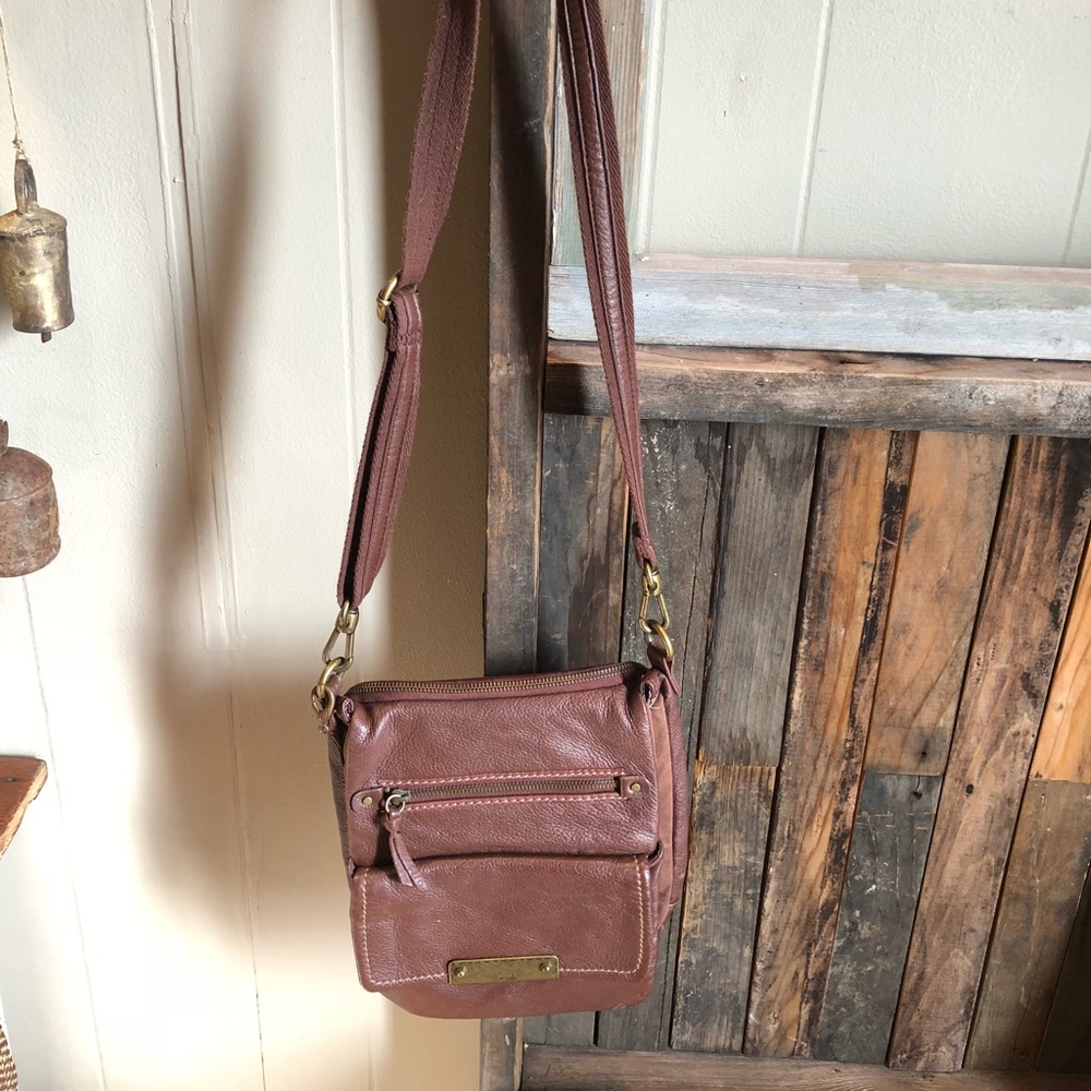 The sak brown leather cross body bag.